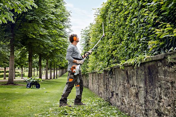 A Stihl long-reach petrol hedge timmer making light work of a hedge row