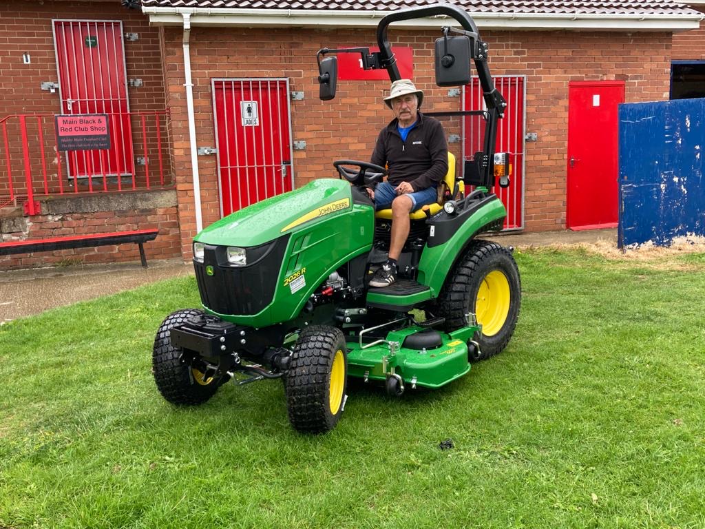 John Deere 2026R compact tractor for amateur football club