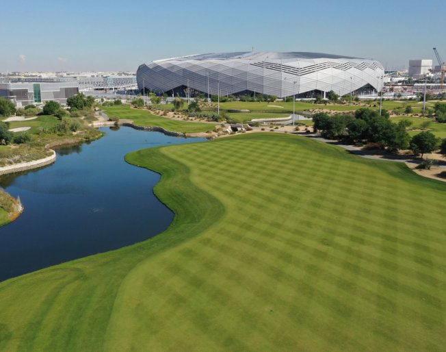 A view over the Education City golf course, with the 2022 FIFA World Cup Education City Stadium in the background.